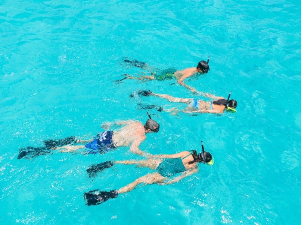 Family snorkeling in Nassau Paradise Island, The Bahamas