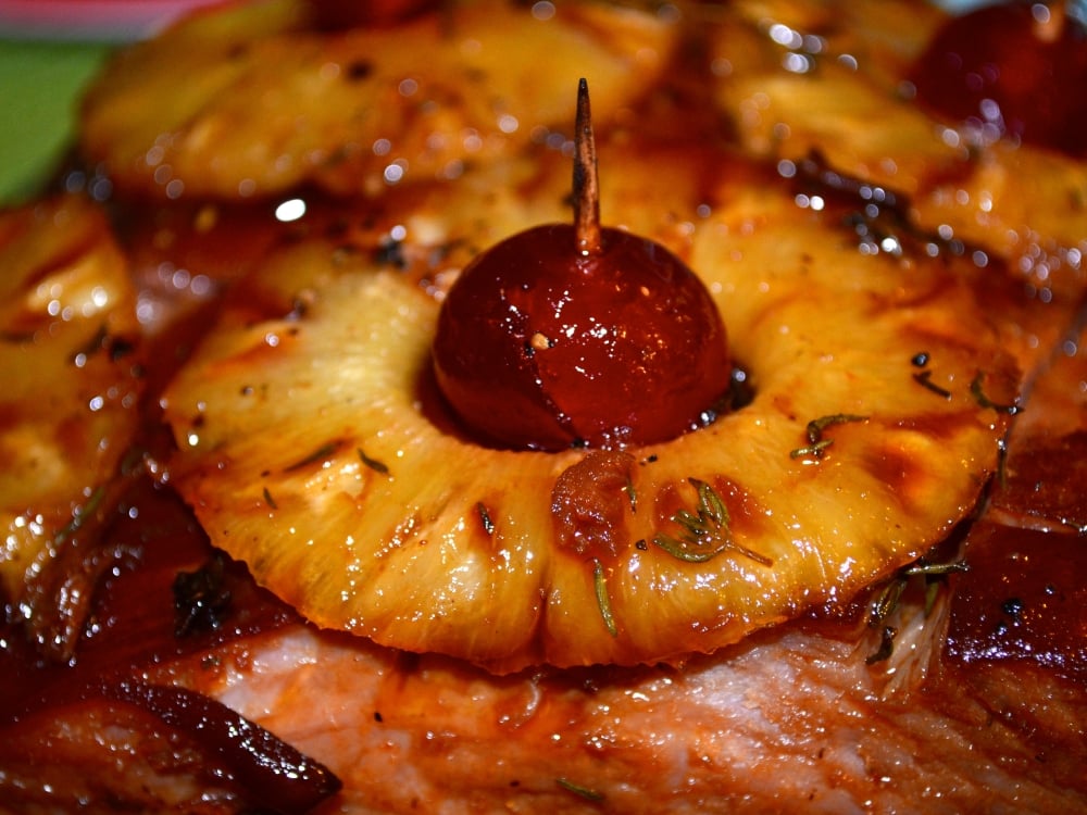 Roasted ham with pineapple and maraschino cherries