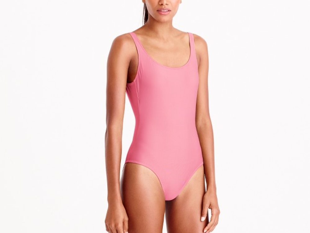 A woman in a pink one-piece swimsuit by JCrew