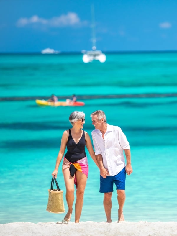 A couple walking on Cable Beach in Nassau Paradise Island