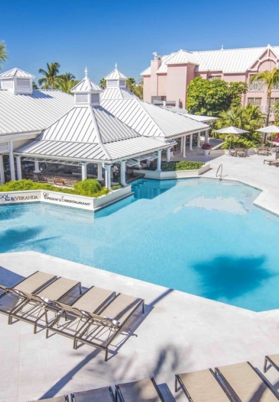 Pool with sun lounging chairs around it