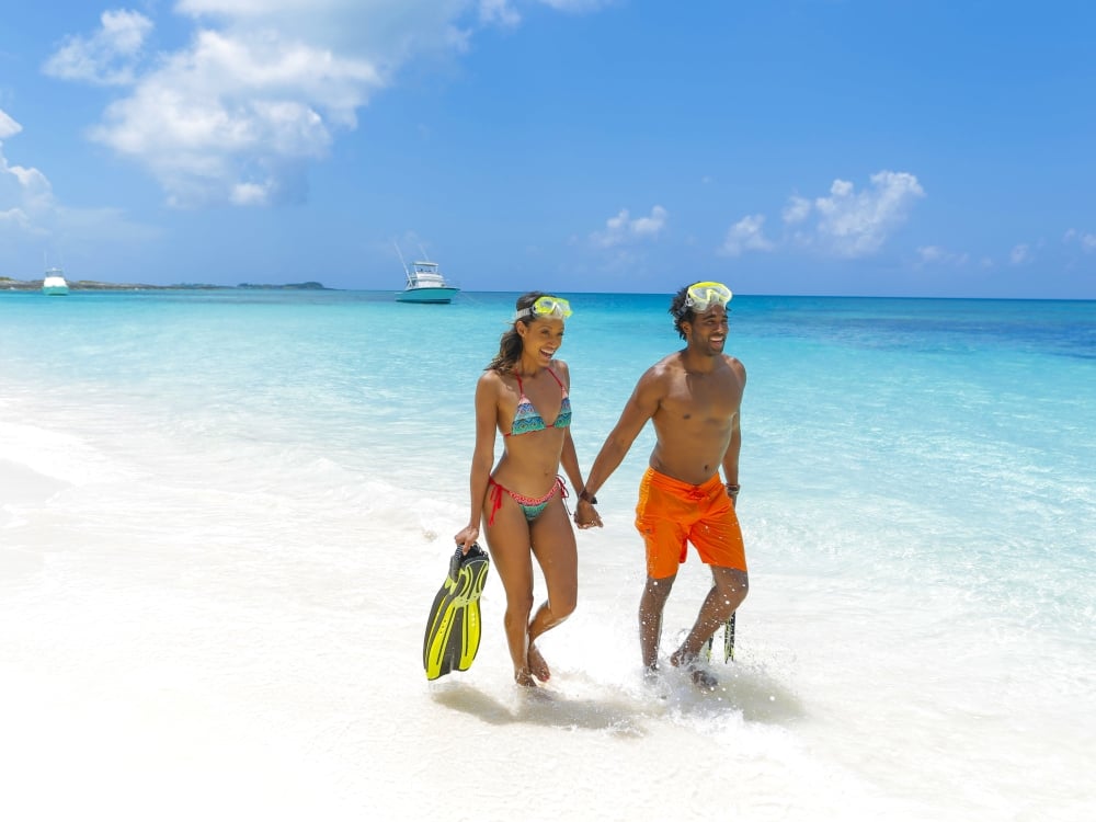 A couple walking on the beach in Nassau