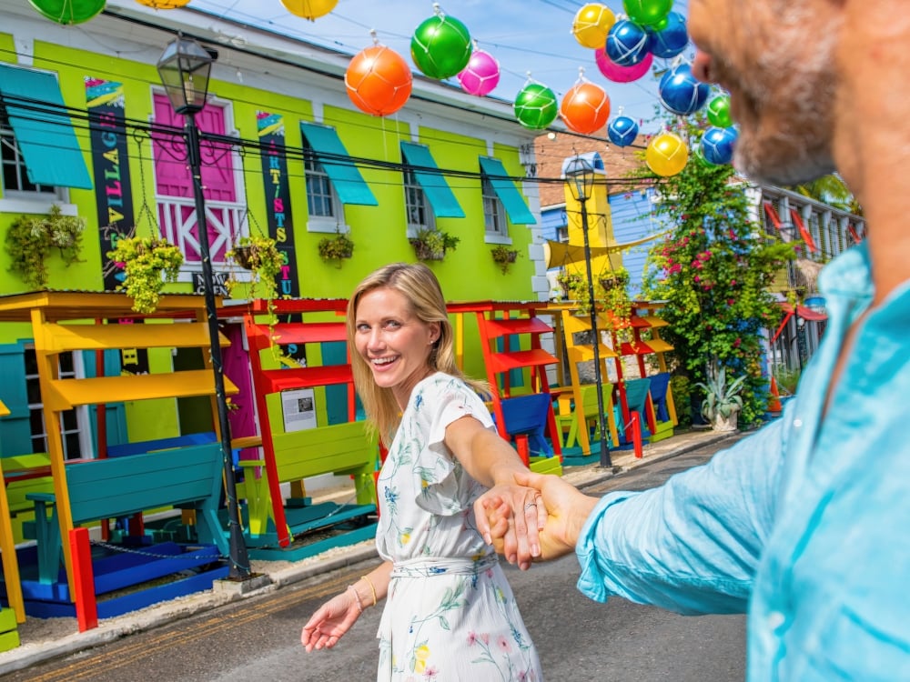 A woman dancing in the street in Nassau