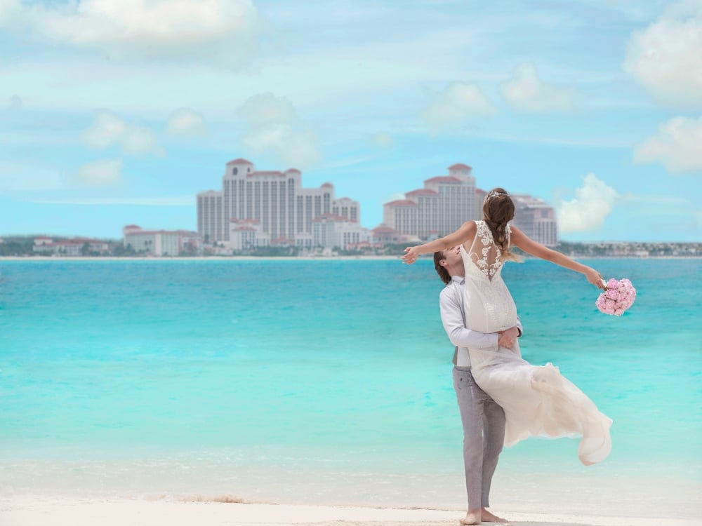 A couple getting married on the beach at Baha Mar Resort