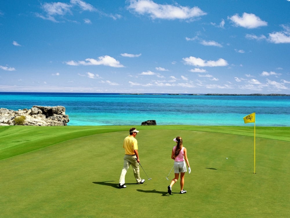 A couple playing golf at Ocean Club Golf Course