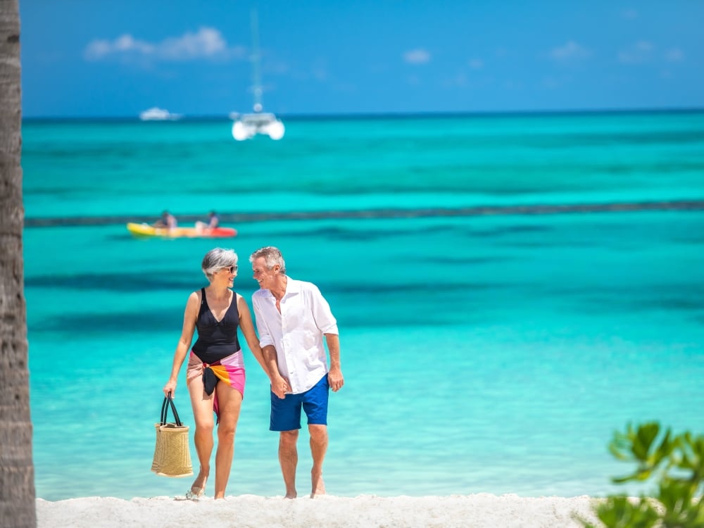 A couple walking on Cable Beach in Nassau Paradise Island