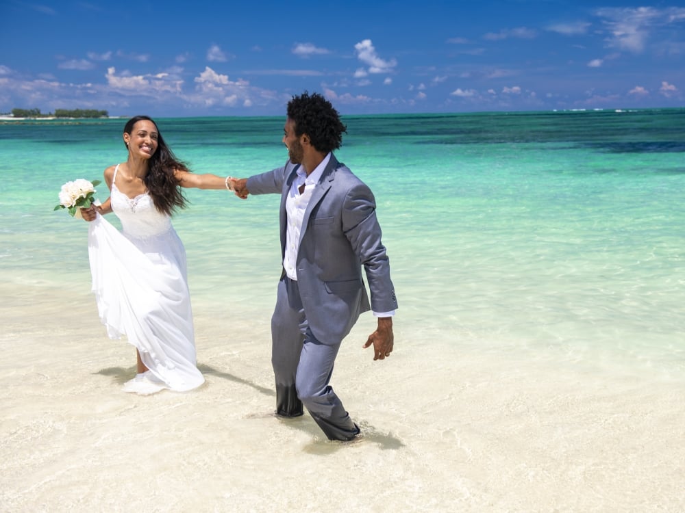 A couple getting married on the beach in Nassau Paradise Island