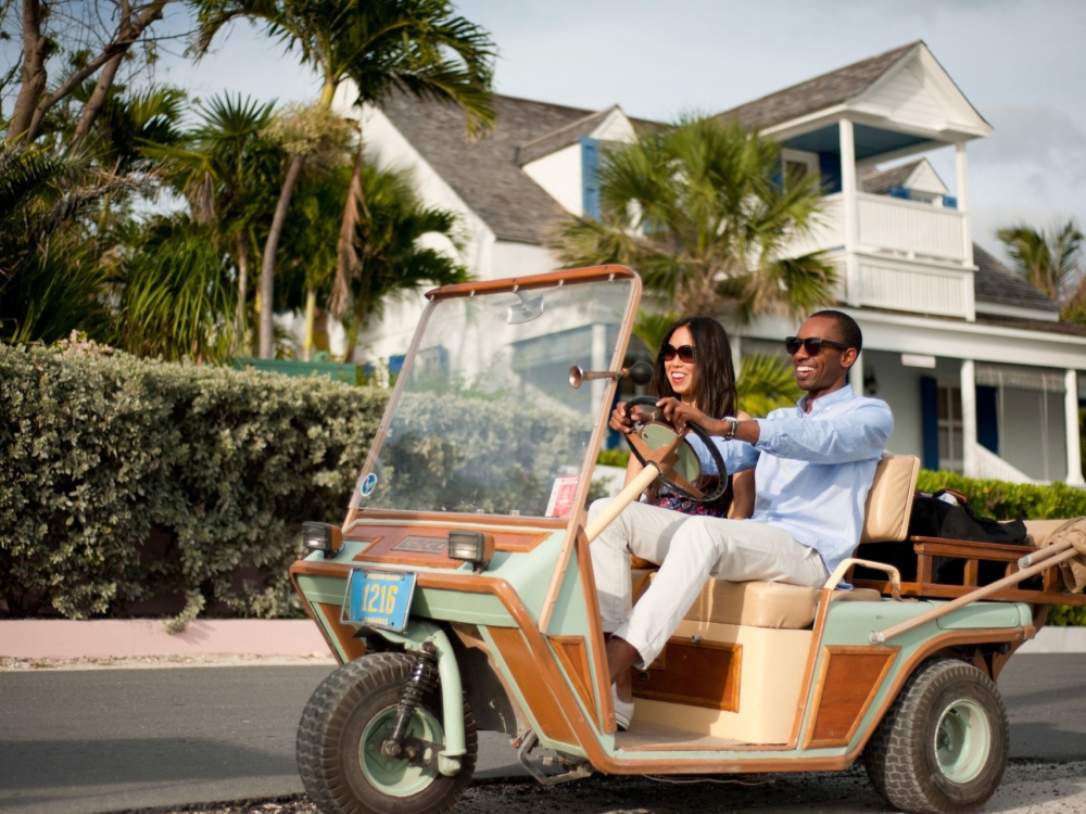 twi people on a golf cart