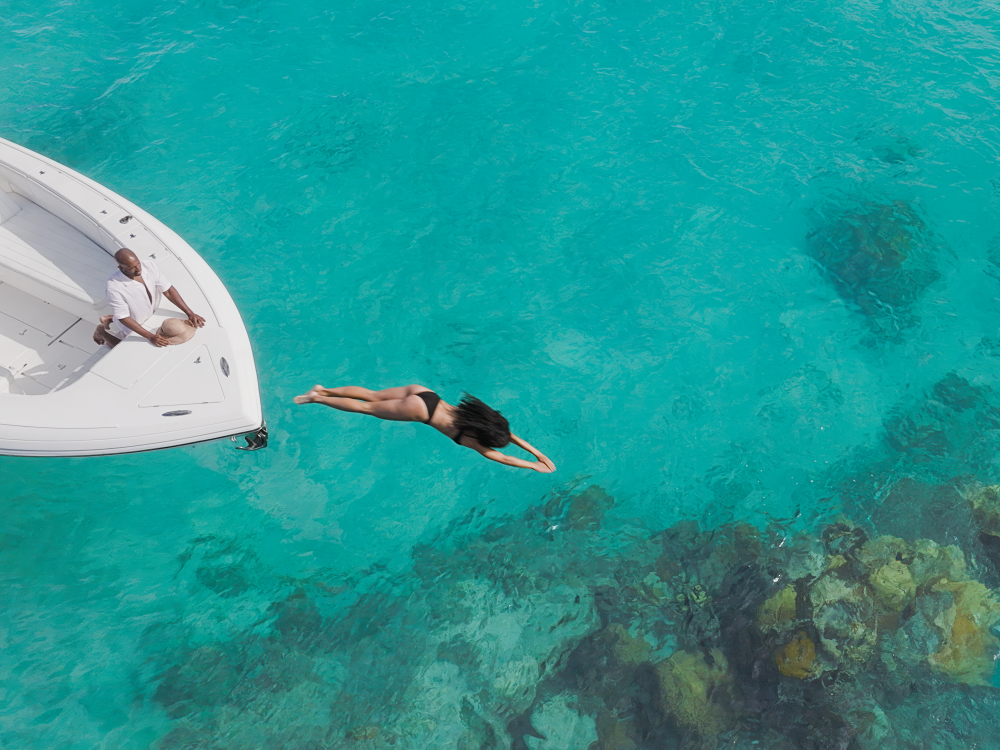 woman jumping off boat