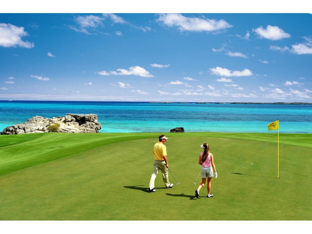 couple walking on golf course