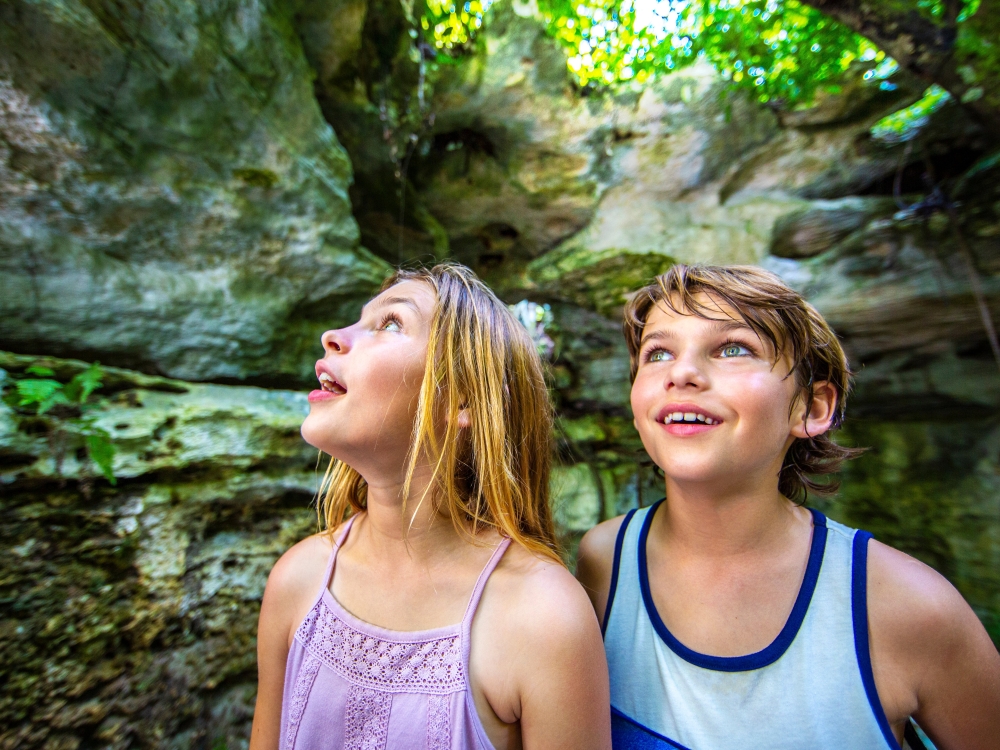 Two kids take in the underground caves in The Bahamas. 