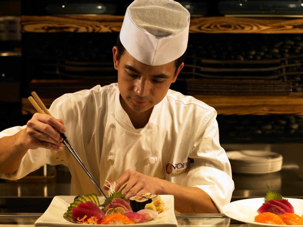 The chef at Nobu in Atlantis Bahamas prepares a plate of sushi.