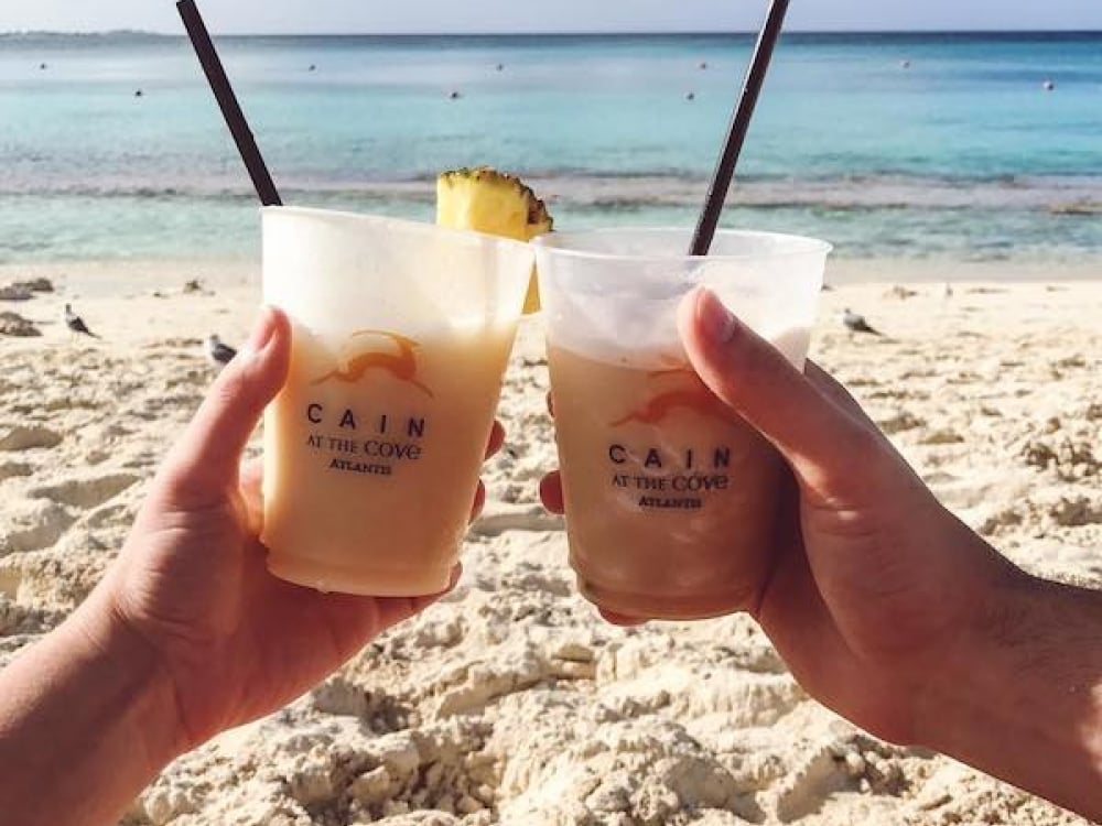 Cheers! Pina Coladas on the Beach at The Cove Atlantis, Paradise Island, Bahamas.