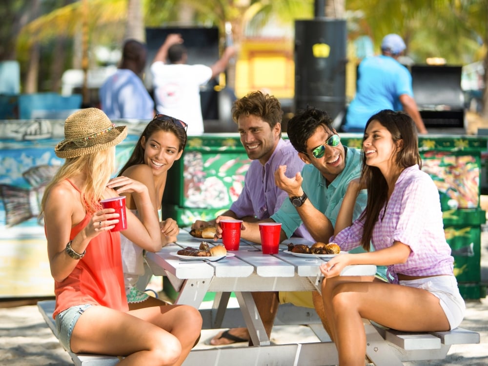 Group of people at Arawak Cay Fish Fry in Nassau Paradise Island, The Bahamas