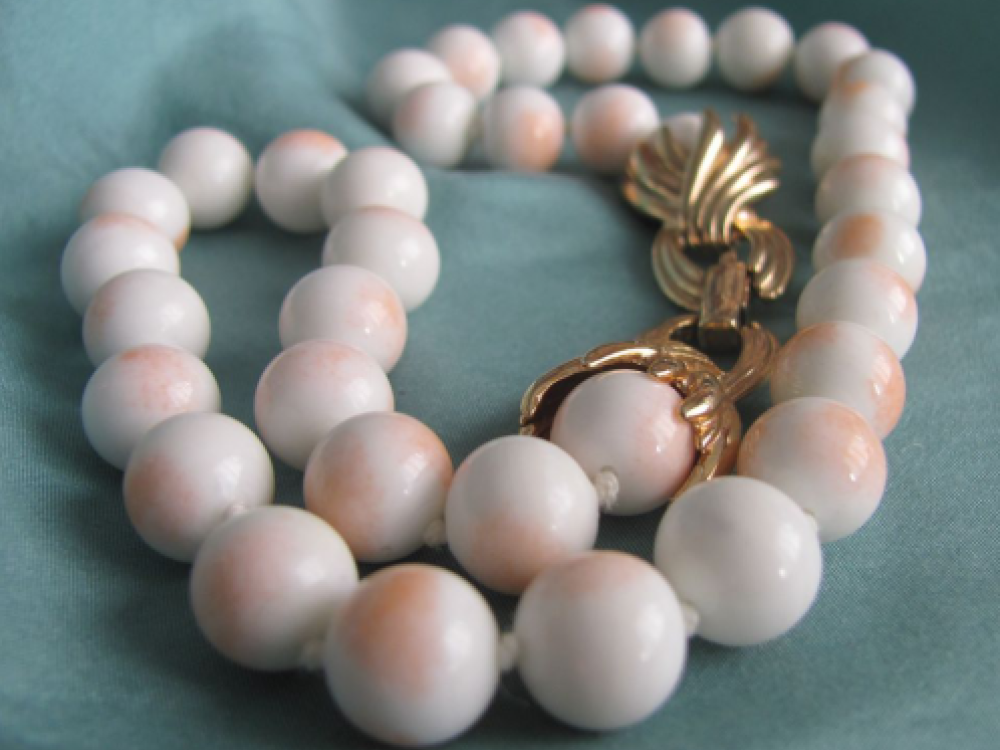 A conch shell and pearl necklace