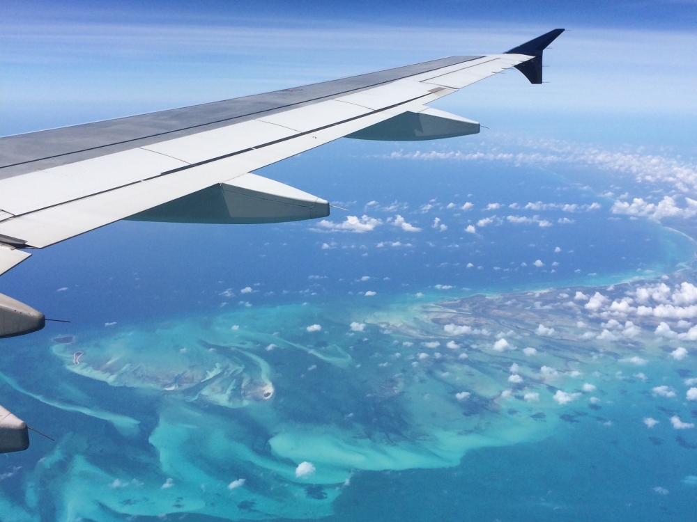 A view of Bahamas' turquoise waters from an airplane. 
