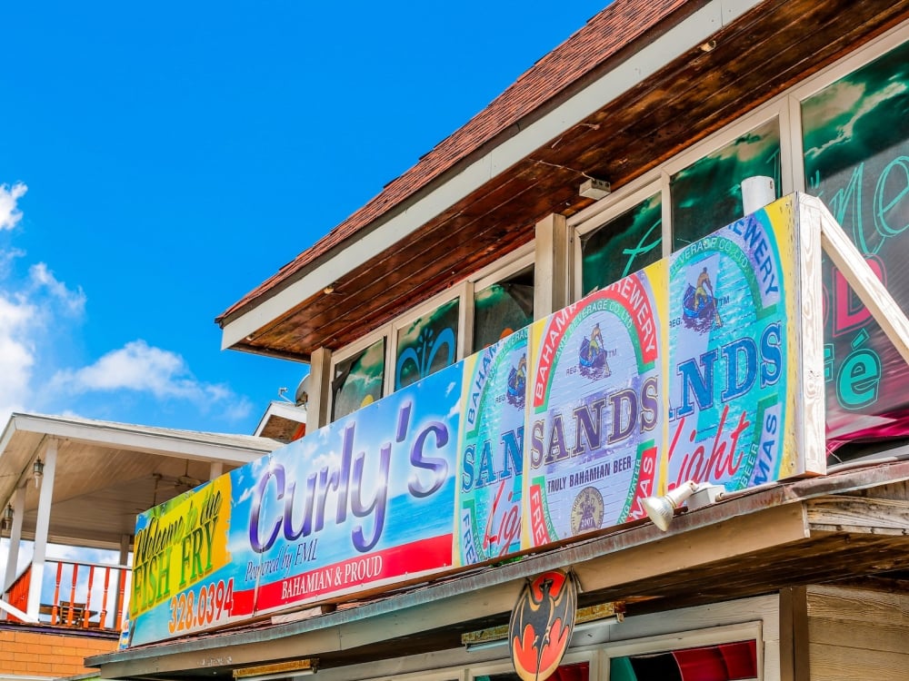 A colorful outdoor sign for The Fish Fry in Nassau, Bahamas