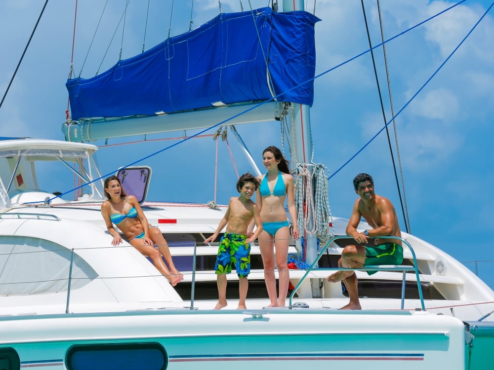 A family of four on a sailboat in Nassau Paradise Island