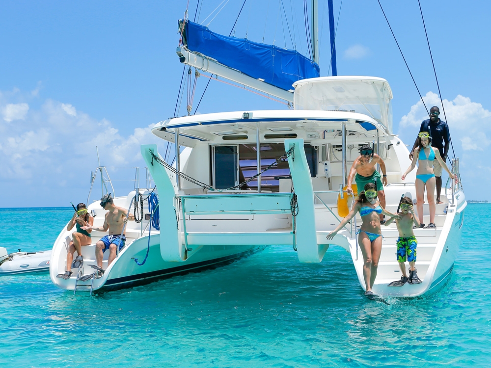 A group of snorkelers on a catamaran in The Bahamas