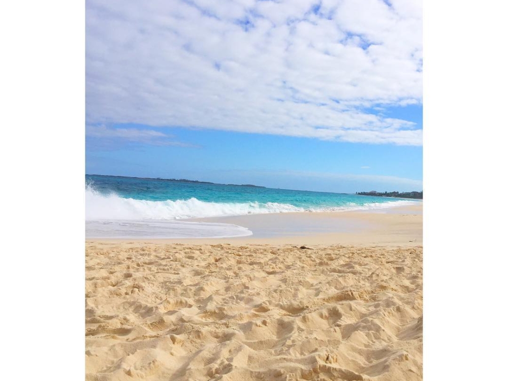 A wave washes ashore at Junkanoo Beach in Nassau.