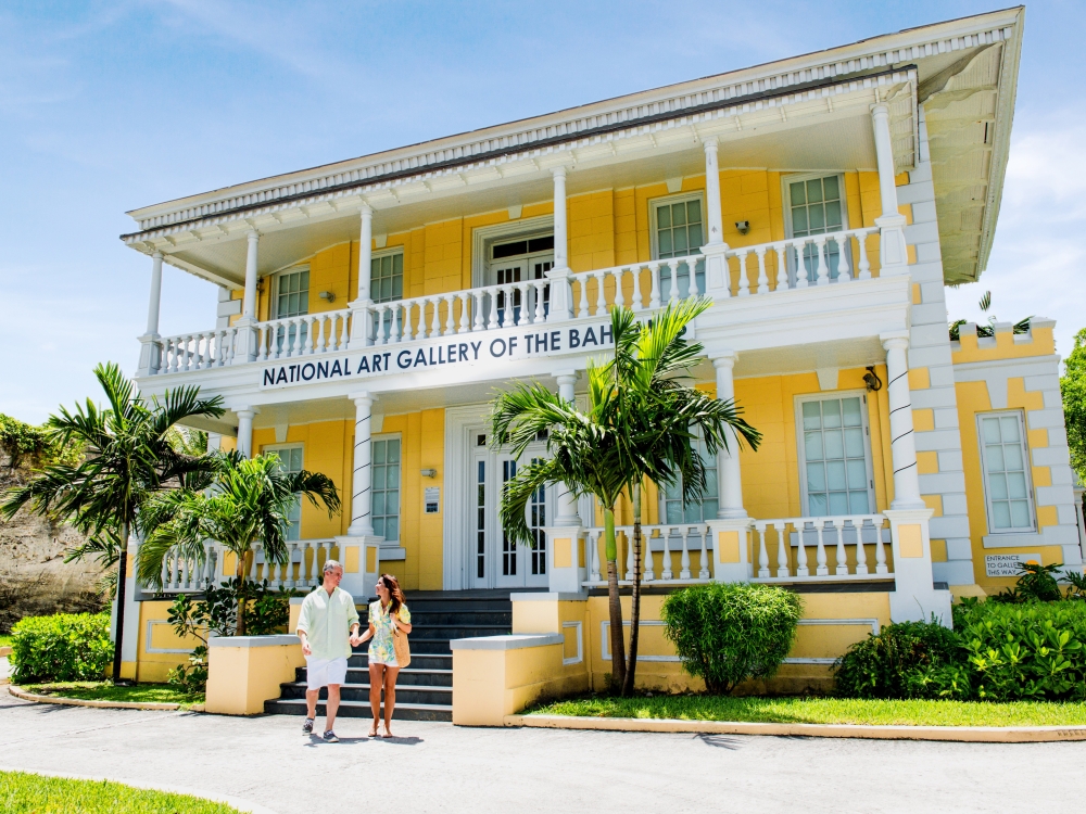 A man and woman exit the National Art Gallery of The Bahamas