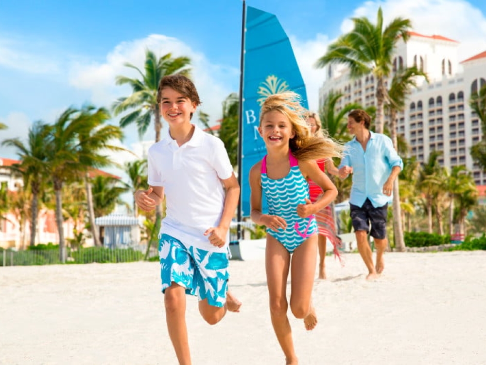 A family on the beach at Baha Mar.