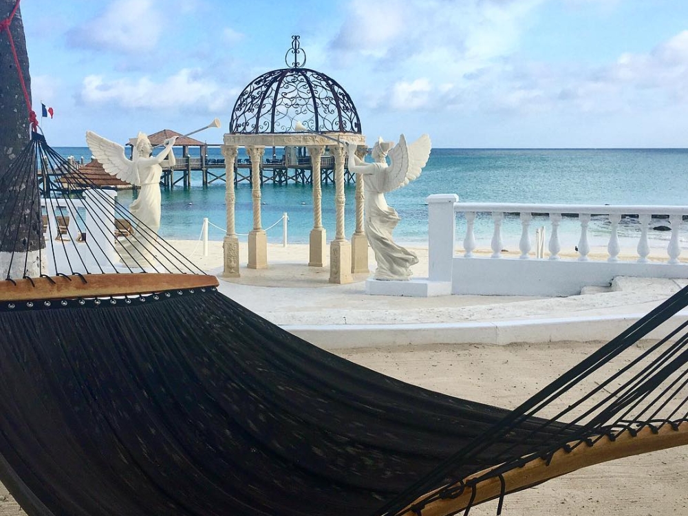 An empty hammock on the beach at Sandals Royal Bahamian.