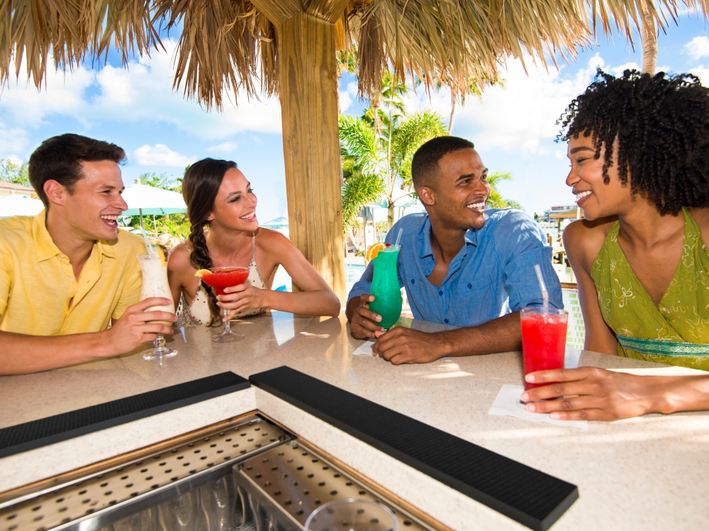 Group of friends at a tiki bar outside