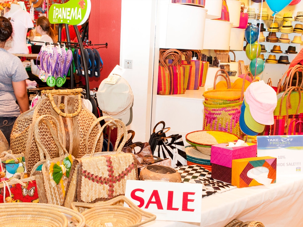 The sale table of a colourful retail store.