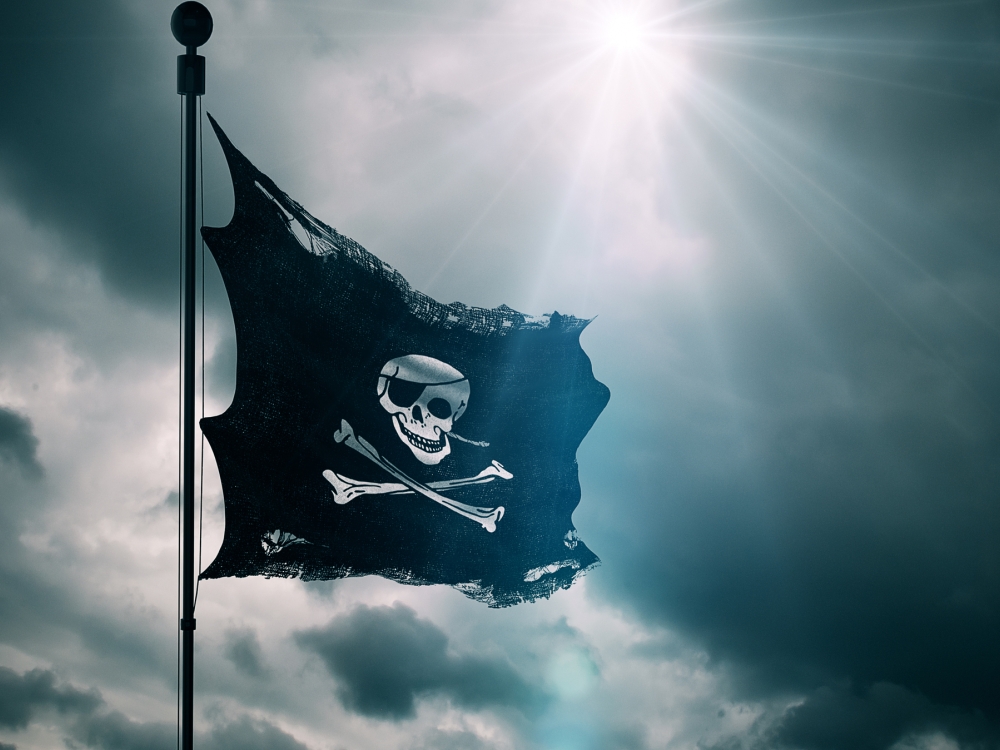 The Jolly Roger Pirate Flag flaps in the breeze. 