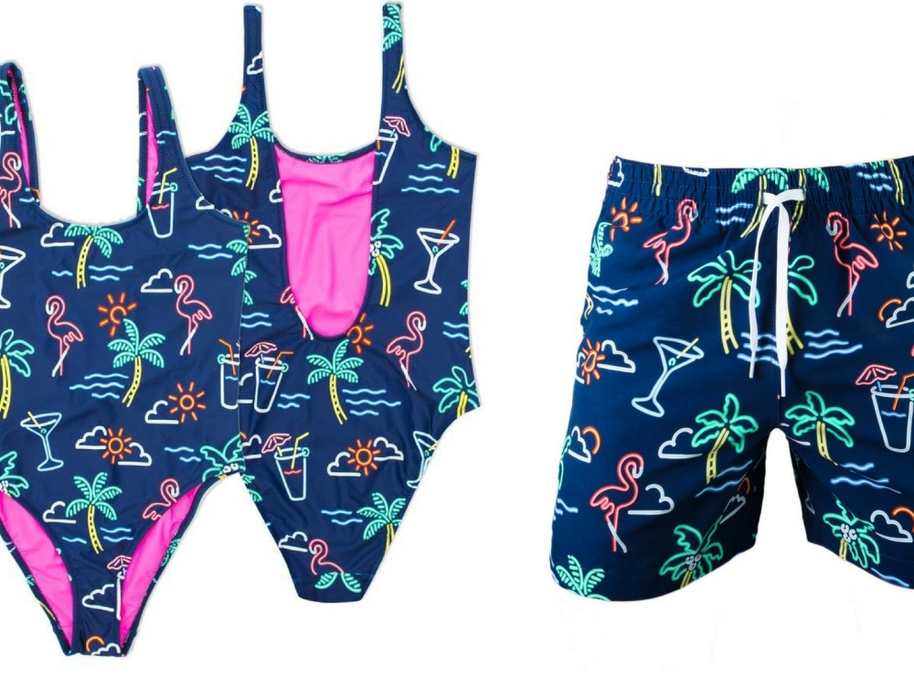 A women's and men's tropical swimsuits.