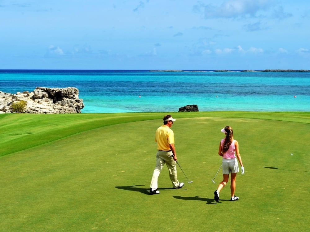 Couple on the green at Ocean Club Golf Course