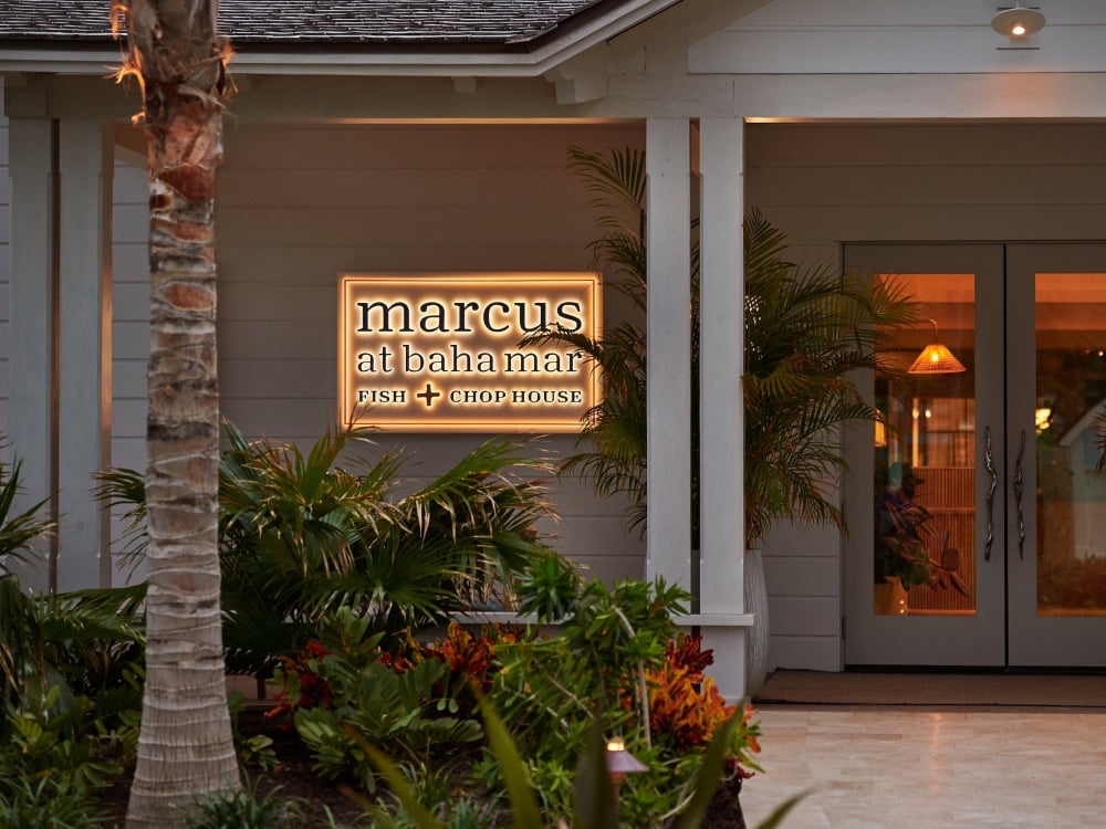 Front door of restaurant with light up sign