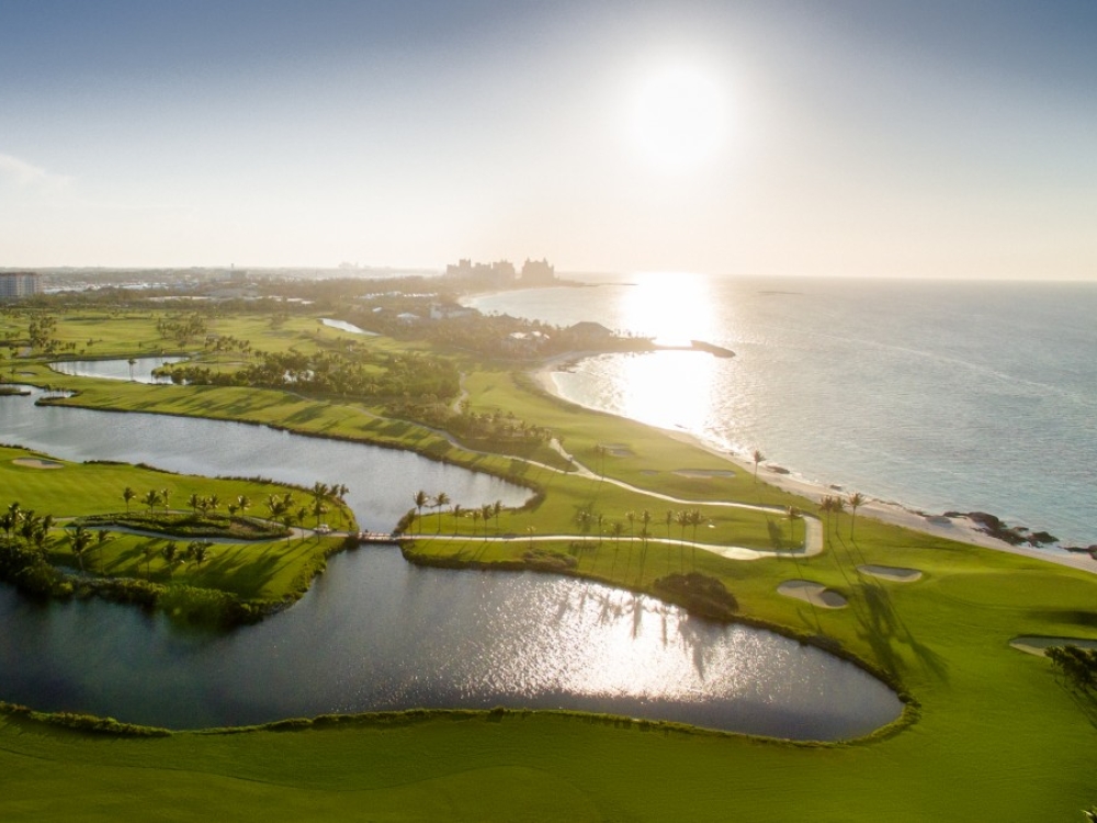 An aerial photo of the Ocean Club Golf Course in The Bahamas at sunrise.