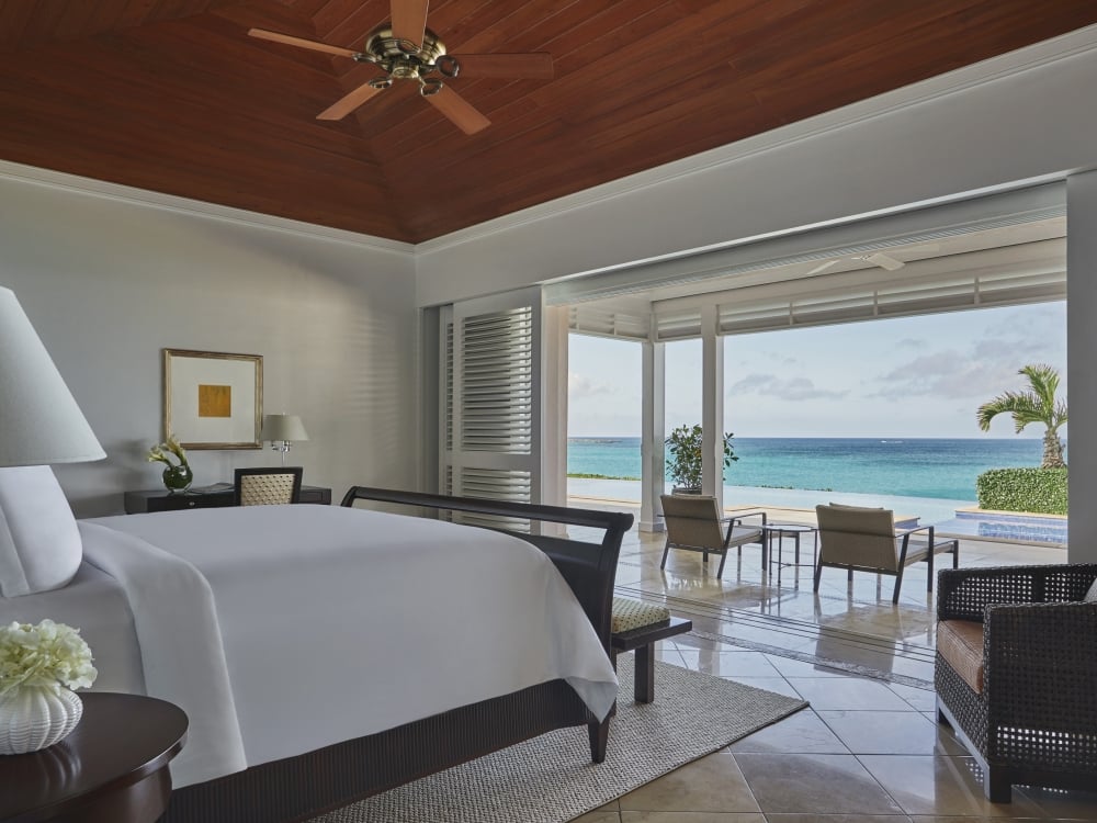 A hotel suite with a terrace overlooking the beach.