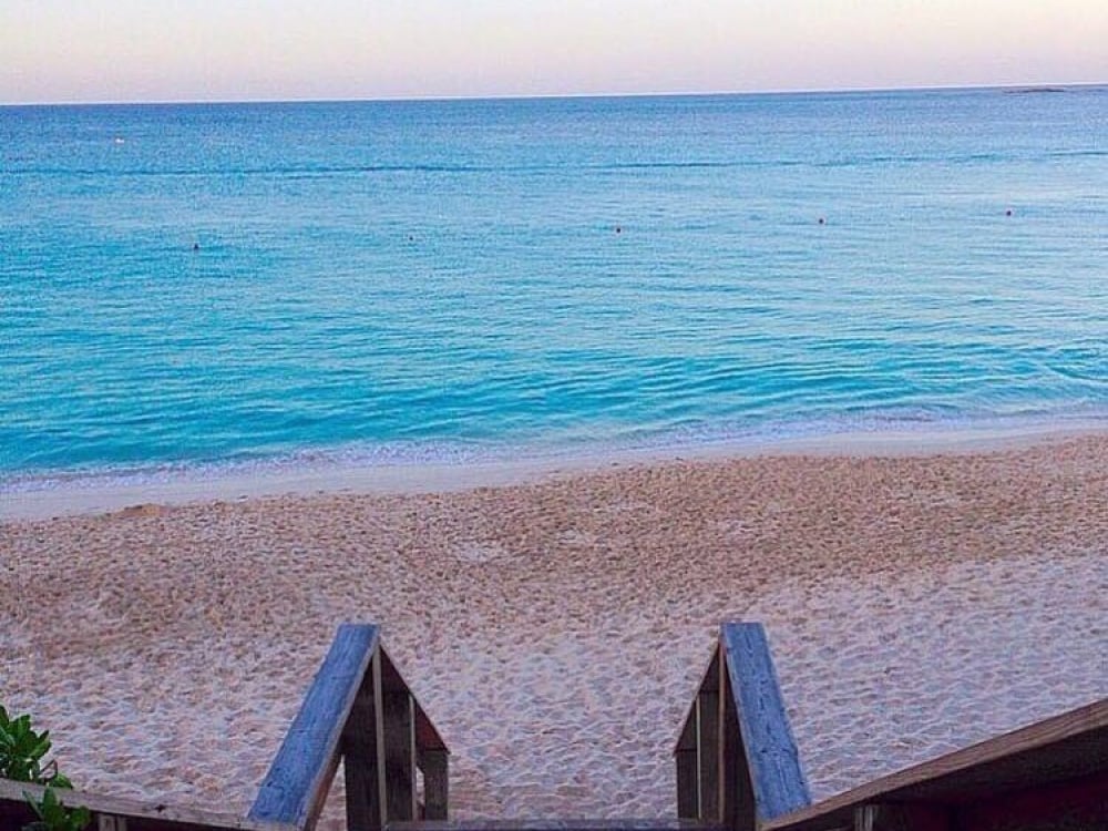 A staircase leads to a beautiful Bahamas beach