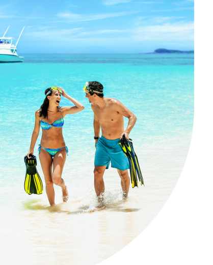 Couple on beach after scuba-diving 