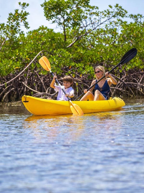 A mother and son kayaking in Nassau
