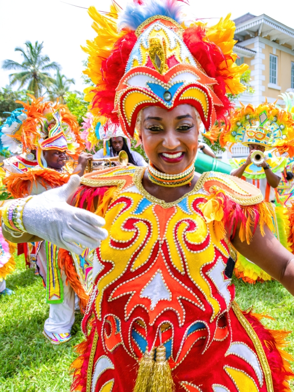 A woman dancing in a traditional Junkanoo costume