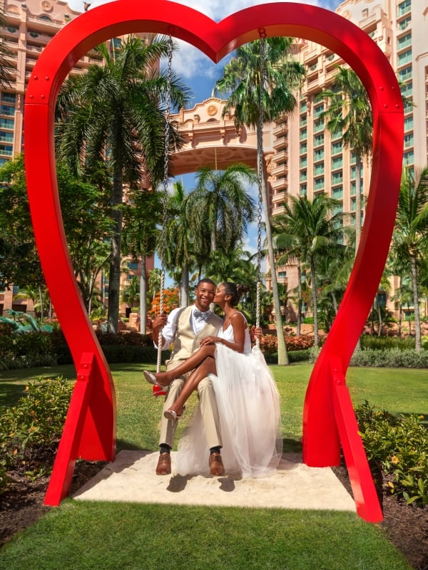 A couple in the heart swing at Atlantis Paradise Island