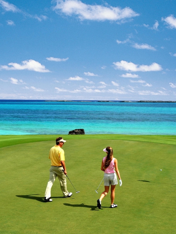A couple playing golf at Ocean Club Golf Course