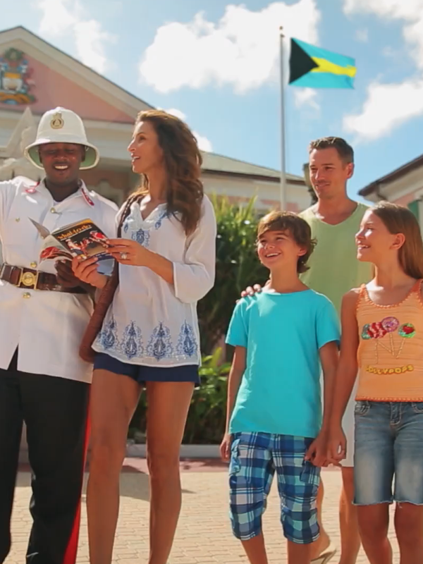 A family getting a tour through Nassau Paradise Island Parliament Square