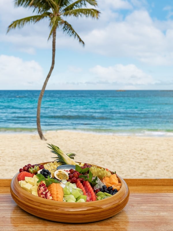 Frezca at Atlantis Paradise Island, a fruit platter on a bar in front of the ocean