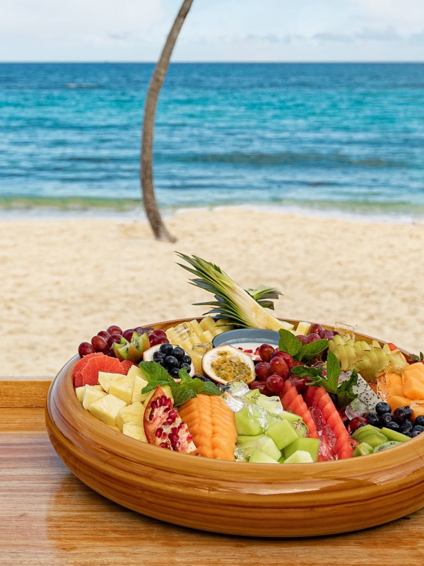 Frezca at Atlantis Paradise Island, a fruit platter on a bar in front of the ocean