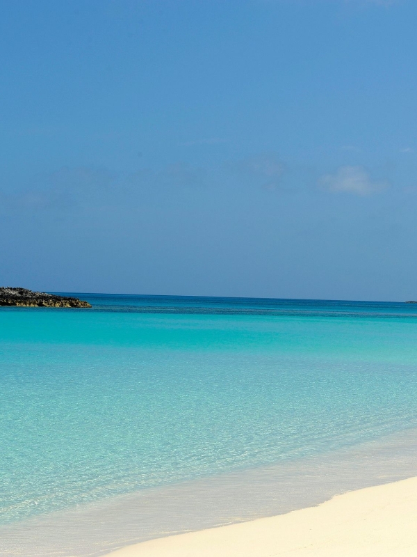 beach with bright blue water