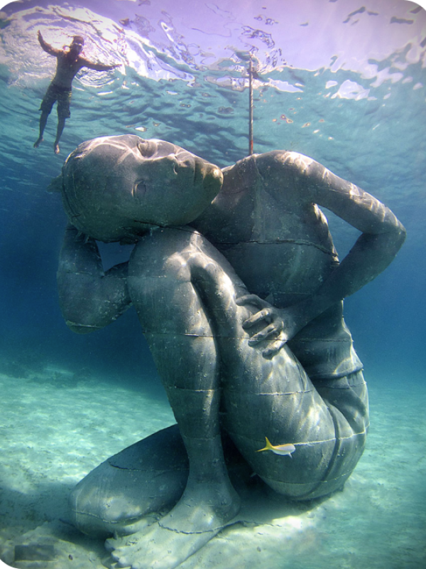 underwater statue and diver