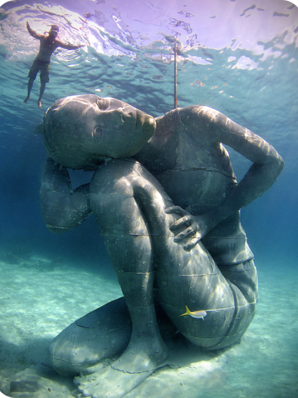 underwater statue and diver