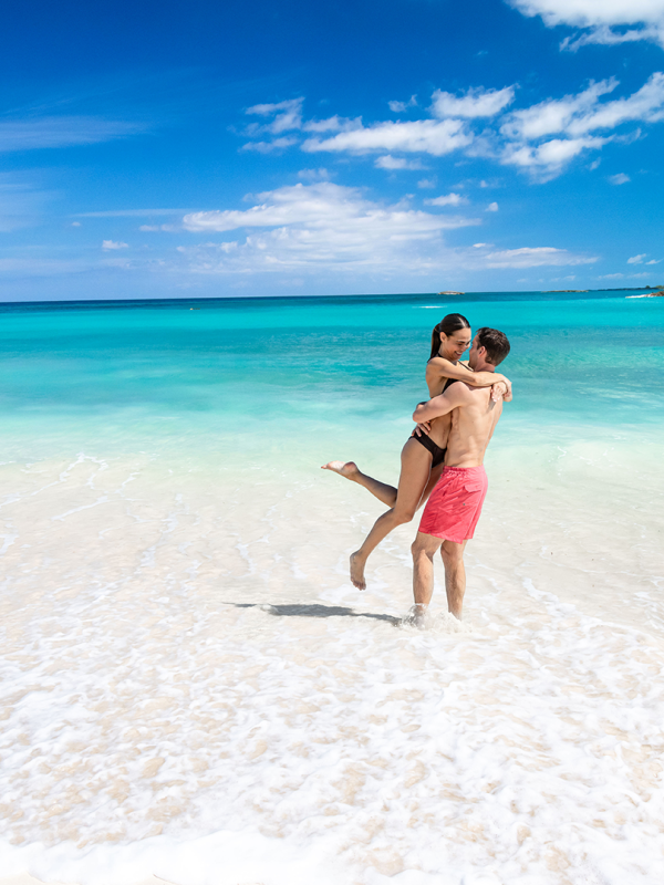 couple hugging on beach 