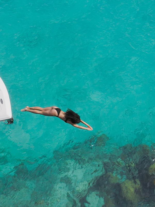 woman jumping off boat
