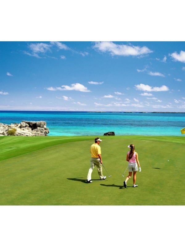 couple walking on golf course